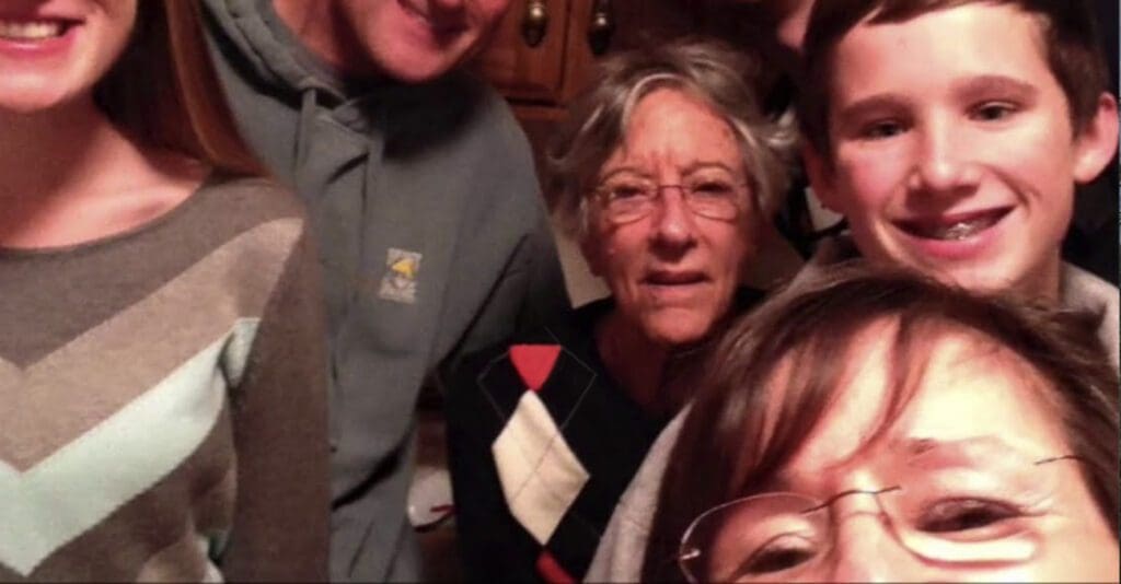 Stepping Stone Falls Video Thumbnail Family Group Surrounded by senior living resident